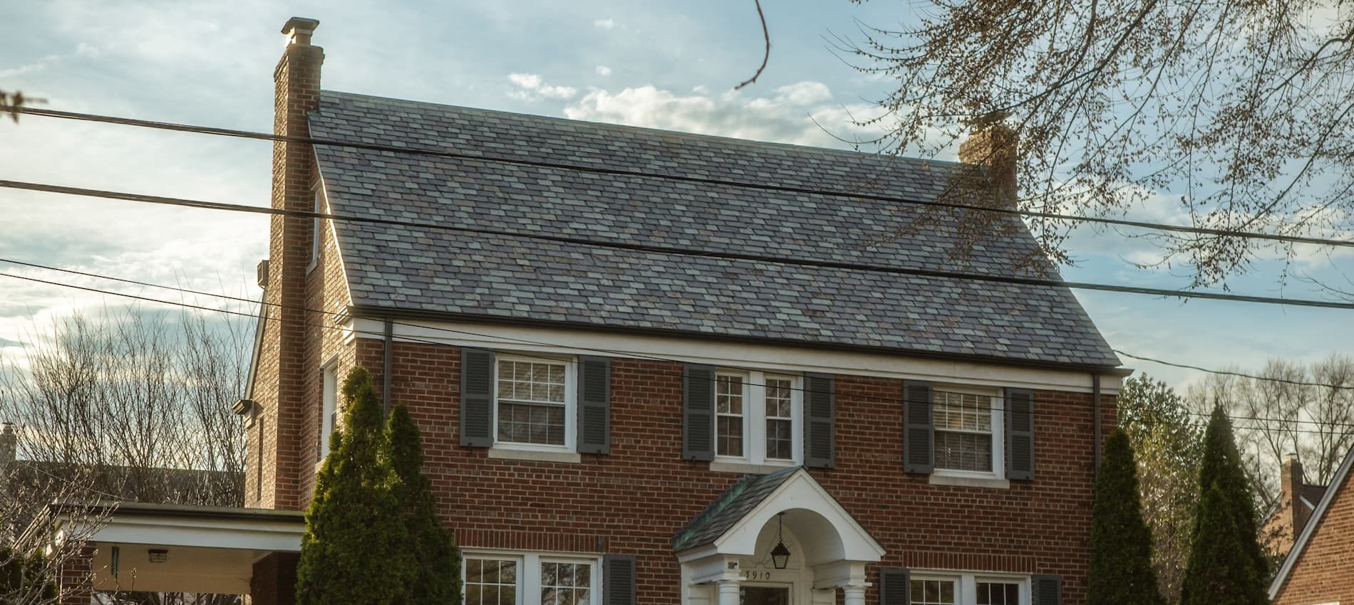 A house on an ordinary street — the kind of place a service call comes from.
